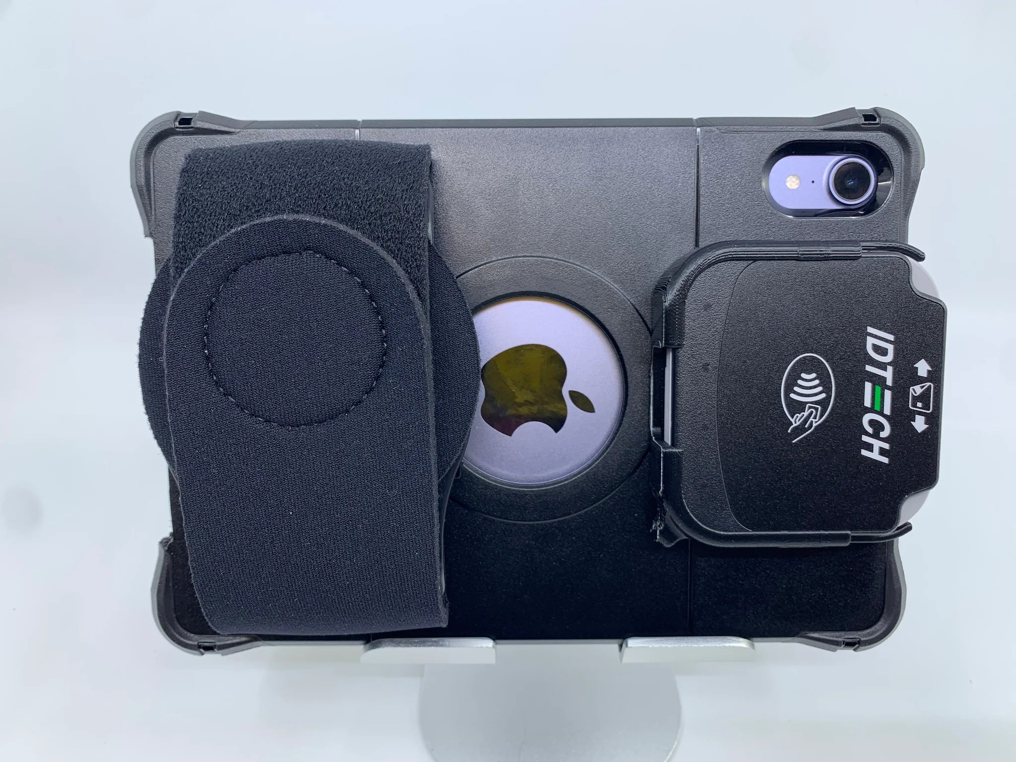 Photo of an iPad with a Handeholder hand strap and an ID Tech card reader attachement.